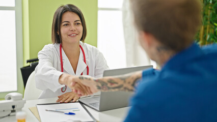 Doctor shaking hands with patient at the clinic