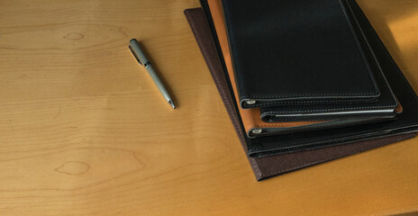file folders and pen on the table.