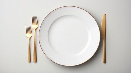 Details on the dining table,Top view of empty plate and gold cutlery on gray background - obrazy, fototapety, plakaty
