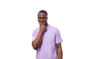 young authentic american guy dressed in a light lilac t-shirt on a white background