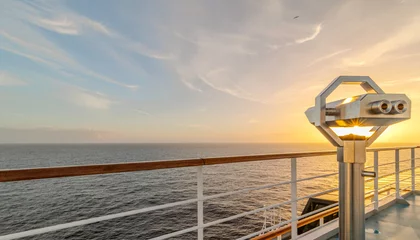 Foto op Canvas Jumelles sur le pont d'un navire de croisière en navigation en mer avec un coucher de soleil.  © ODIN Daniel