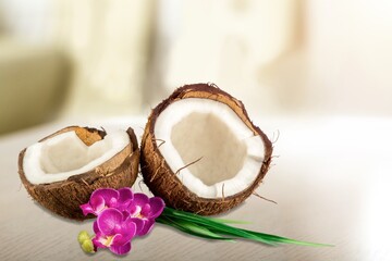 Tasty fresh coconut with slice on desk