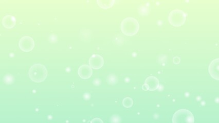 グリーンのグラデーションの玉ボケ背景画像