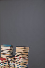 stack of books on grey background learning library learning science