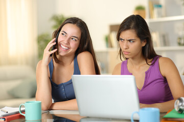 Suspicious student listening a friend talking on phone