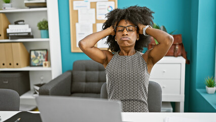 African american woman business worker using laptop stressed at the office