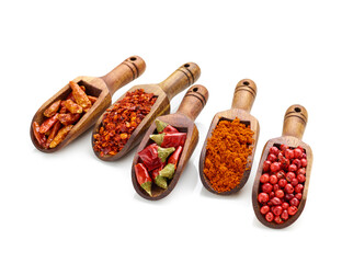 assortment of seasoning in wooden spoons isolated on white background