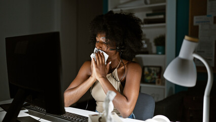 African american woman business worker using computer sneezing at the office