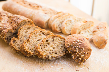 Fresh loaf of bread on wooden board