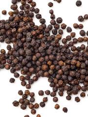 Pile of black pepper peppercorn seeds isolated on white background