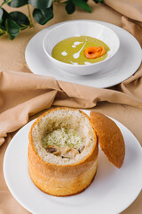 Delicious green spinach cream-soup with salmon