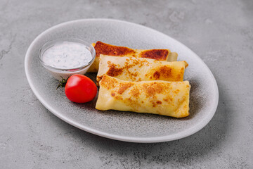 thin pancakes on plate top view