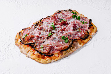 pizza with prosciutto parma ham with parmesan cheese