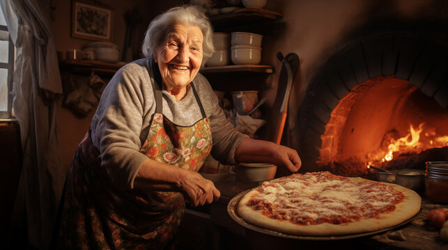 Senior Italian woman in apron in the process of making pizza in a village house kitchen, concept of Italian cuisine, traditional cooking, family traditions and the art of making homemade pizza.