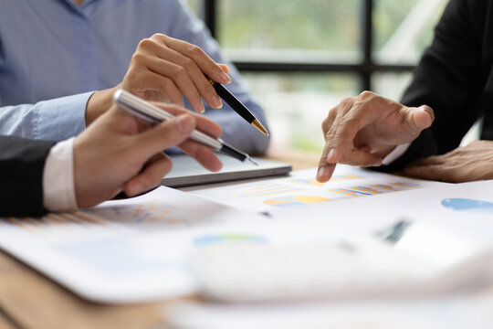 Business meeting, Business partners and colleagues in office discussing strategic analysis and planning business investment projects together.