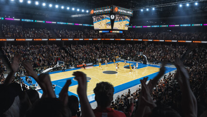 High Angle Establishing Wide Shot of a Whole Arena of Spectators Watching a Basketball Championship Game. Teams Play, Crowds of Fans Raise Hands and Cheer. Sports Channel Live Television Broadcast - obrazy, fototapety, plakaty
