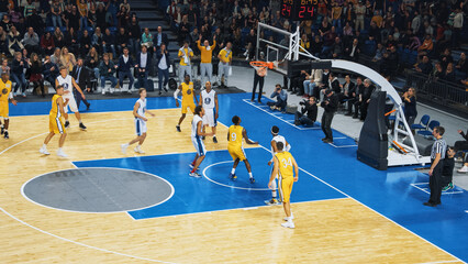 Basketball Action for Live TV Channel: Yellow Team Scores a Goal from a Distance and Retrieves the...