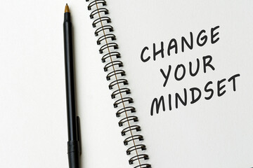 Motivational quote on notepad - Change your mindset.