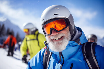 A smiling old man on the ski slopes in a winter sunny day. - obrazy, fototapety, plakaty