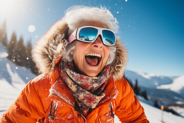 A smiling old woman on the ski slopes in a winter sunny day.