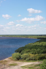 Fototapeta na wymiar blue beautiful river turn , with a green bank