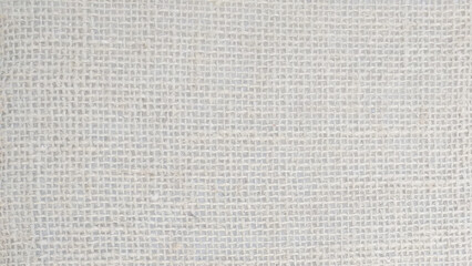 White abstract Hessian or sackcloth fabric or hemp sack texture background. Wallpaper of artistic wale linen canvas. Blanket or Curtain of cotton pattern with space for text decoration. Light pattern.
