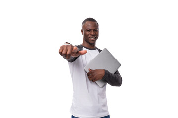 young successful student african guy with short haircut uses laptop for school