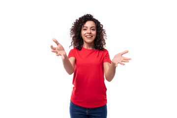 young advertiser woman dressed in a red basic t-shirt on a white background with copy space