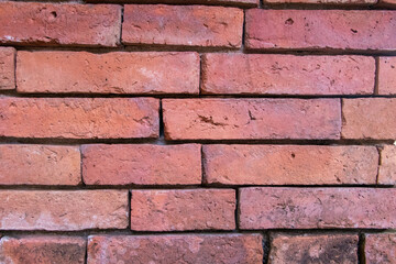 Red brick walls are neatly stacked, beautiful and natural to an ancient construction site.