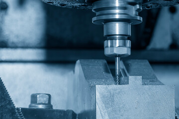 The CNC milling machine cutting press die part by solid bull end mill tool and G-code data...
