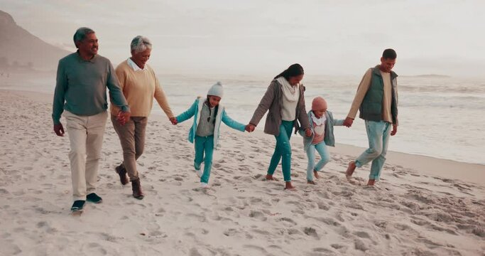 Holding hands, big family and beach walk in nature for freedom, travel and bonding in fresh air. Love, generations and children with parents and grandparents and the ocean, relax and walking in Bali