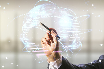 Man hand with pen working with abstract graphic digital world map with connections on blurred...