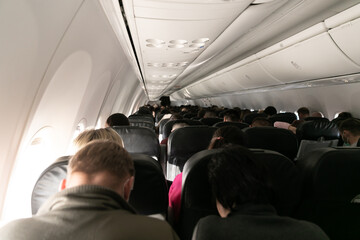 passengers in the cabin of the aircraft travel flight