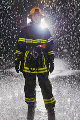 A determined female firefighter in a professional uniform striding through the dangerous, rainy night on a daring rescue mission, showcasing her unwavering bravery and commitment to saving lives.