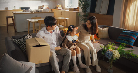 Portrait of a Happy Korean Family Arriving at Their Newly Purchased Home: Parents and Their Cute...