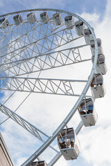 Big tall white ferris wheel in front of perfect blue sky in Bukovel. Carpathians Ukraine