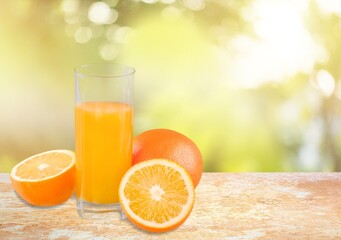 Fresh sweet orange juice in glass on table