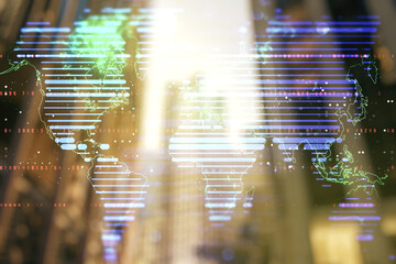 Double exposure of abstract digital world map on modern skyscrapers background, research and strategy concept