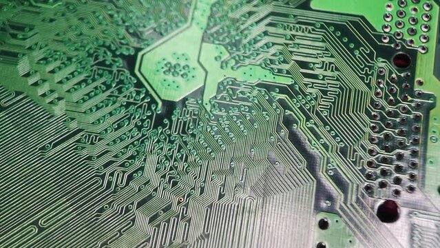 Printed circuit board with electronic components of the computer connection to the socket, chip, top view. Green textolite of an electronic chip with resistors