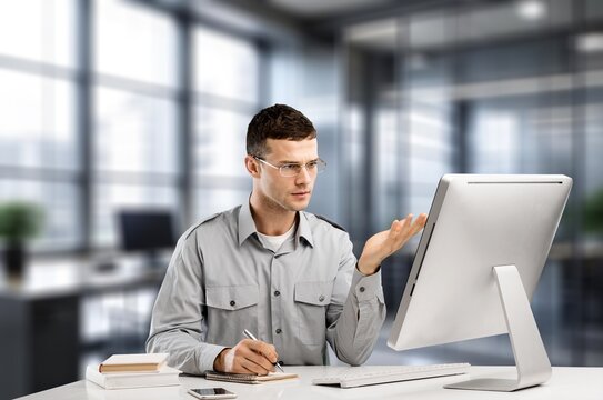 Young businessman using a computer in office, AI generated image