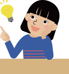 机の前で考え事をしてひらめいた長袖の服を着た黒髪の日本人女性