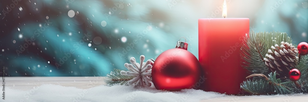 Canvas Prints  a red candle sitting on top of a table next to a pine cone and a red christmas ornament.