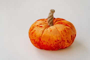 Orange decorative pumpkins are made of fabric. Autumn season
