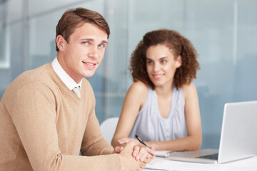 Businessman, laptop and meeting in portrait, smile and working on project, proposal and strategy. People, planning and vision or agenda, teamwork and technology or collaboration and communication