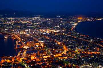 Fototapeta na wymiar sunset or sun rise of Hakodate cityscape with Skyline and office building and downtown of Hakodate is populars ciy from toursim Hokkaido, Japan with twilight sky in spring season