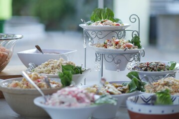 Closeup of salad catering in luxurious utensil against a blurred background