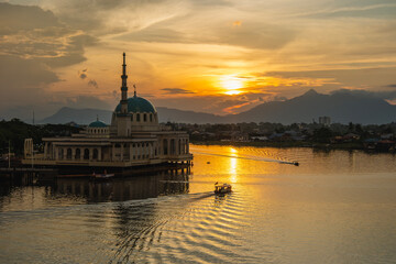 India Mosque Kuching with a view of the waterfront of Sarawak River during sunset. One of the...