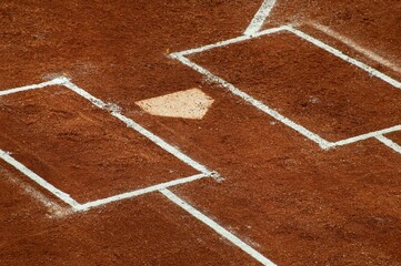 Home of the first base with white chalk lines in a baseball field