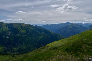 Fototapeta premium Landscape view of the mountains against a blue clouded sky