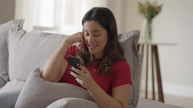 Woman using smartphone. Happy caucasian female enjoy online chat, internet purchase, browse web, download new cool freeware application. 